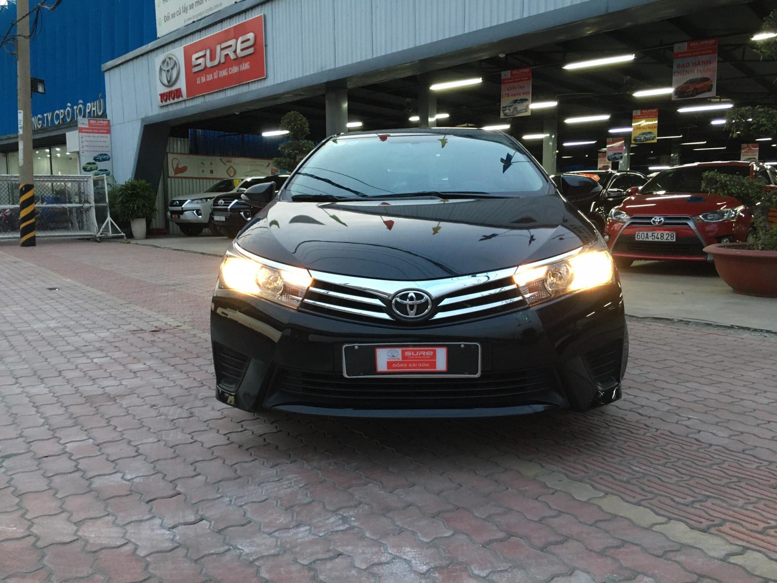 Cần bán xe Toyota Corolla Altis 1.8G đời 2014, màu đen, giá thương lượng