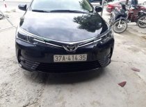 Toyota Corolla Altis   2018 - Bán Toyota Corolla altis sản xuất năm 2018, màu đen, chính chủ giá 830 triệu tại Nghệ An