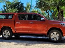 Toyota Hilux 2016 - Màu cam đỏ, đã sử dụng giá 675 triệu tại Hà Nội