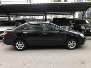 Toyota Corona  G 1.8  2004 - Cần bán gấp Toyota Corona G 1.8 sản xuất 2004, màu đen số sàn