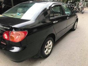 Toyota Corona  G 1.8  2004 - Cần bán gấp Toyota Corona G 1.8 sản xuất 2004, màu đen số sàn