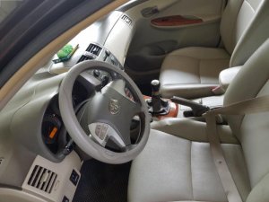 Toyota Corolla Altis 2009 - Bán Toyota Corolla altis sản xuất năm 2009, màu đen số sàn, giá chỉ 385 triệu