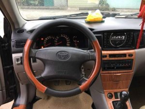 Toyota Corolla Altis 1.8G MT 2003 - Bán Toyota Corolla altis 1.8G MT đời 2003, màu đen số sàn, giá chỉ 243 triệu