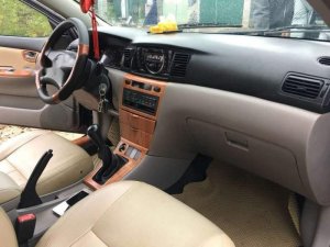 Toyota Corolla Altis 1.8G MT 2003 - Bán Toyota Corolla altis 1.8G MT đời 2003, màu đen số sàn, giá chỉ 243 triệu