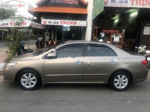 Toyota Corolla Altis 2009 - Cần bán lại xe Toyota Corolla altis năm 2009, màu vàng xe gia đình