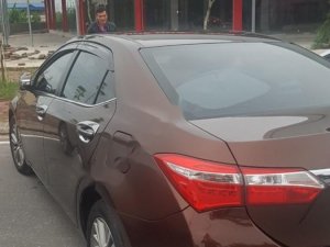 Toyota Corolla Altis 1.8G MT 2015 - Bán Toyota Corolla altis 1.8G MT đời 2015, màu nâu, đẹp như mới