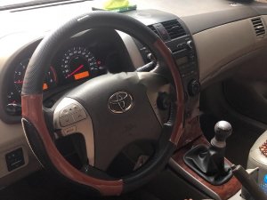 Toyota Corolla Altis 1.8G MT 2009 - Bán xe Toyota Corolla Altis 1.8G sx 2009, số tay, máy xăng, màu đen, nội thất màu kem, đã đi 154000 km