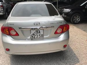 Toyota Corolla Altis 1.8G MT 2009 - Bán Toyota Corolla altis 1.8G MT 2009, màu bạc như mới  