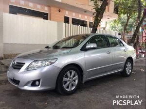 Toyota Corolla Altis 2009 - Cần bán gấp Toyota Corolla altis 2009, màu bạc số tự động