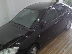 Toyota Corolla Altis 1.8G MT 2003 - Cần bán Toyota Corolla altis 1.8G MT đời 2003, màu đen  