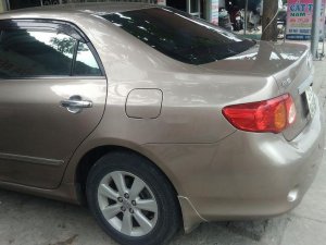 Toyota Corolla Altis   2010 - Bán Toyota Corolla altis đời 2010, màu vàng, nhập khẩu nguyên chiếc, 465 triệu