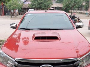 Toyota Hilux 2015 - Xe Toyota Hilux sản xuất 2015, màu đỏ số sàn