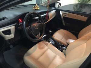 Toyota Corolla 2015 - Cần bán lại xe Toyota Corolla sản xuất năm 2015, màu đen xe gia đình, giá 519tr