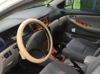 Toyota Corolla J 1.3 MT 2003 - Cần bán xe Toyota Corolla J 1.3 MT đời 2003, màu trắng chính chủ