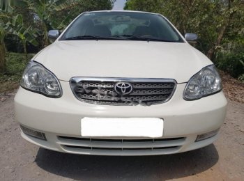 Toyota Corolla Altis 1.3 MT 2003 - Bán Toyota Corolla Altis đời 2003, màu trắng xe gia đình, giá 238tr