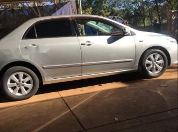 Toyota Corolla Altis 2009 - Cần bán gấp Toyota Corolla Altis đời 2009, màu bạc xe gia đình