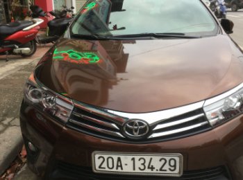 Toyota Corolla Altis   1.8 AT  2015 - Cần bán Toyota Corolla altis 1.8 AT năm 2015, màu nâu
