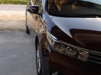 Toyota Corolla Altis 1.8G MT 2015 - Bán Toyota Corolla altis 1.8G MT đời 2015, màu nâu, đẹp như mới