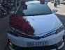 Toyota Corolla Altis 1.8E 2017 - Bán xe Toyota Corolla altis 1.8E sản xuất 2017, màu trắng chính chủ, 690 triệu