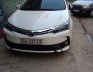 Toyota Corolla Altis 1.8E 2017 - Bán xe Toyota Corolla altis 1.8E sản xuất 2017, màu trắng chính chủ, 690 triệu